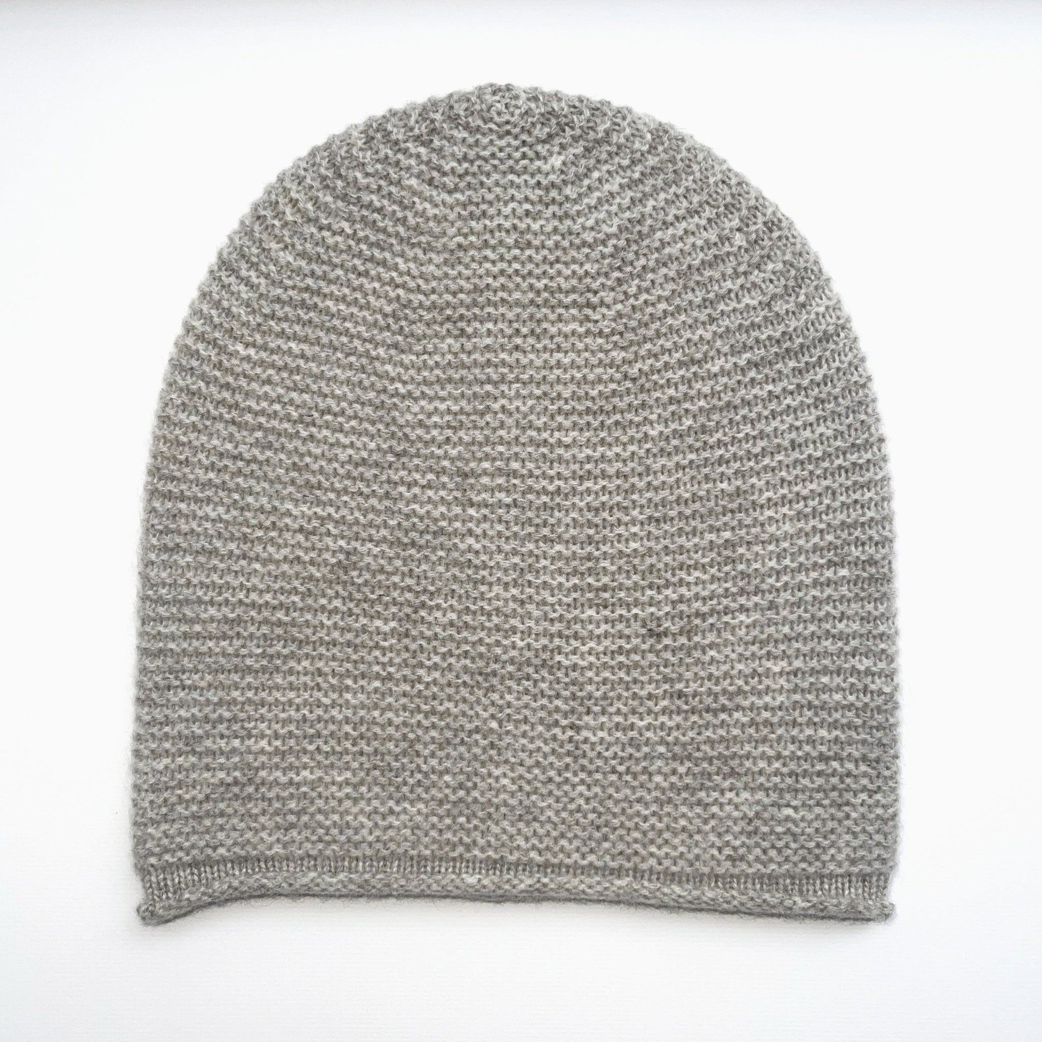 Gray knit beanie on a white background