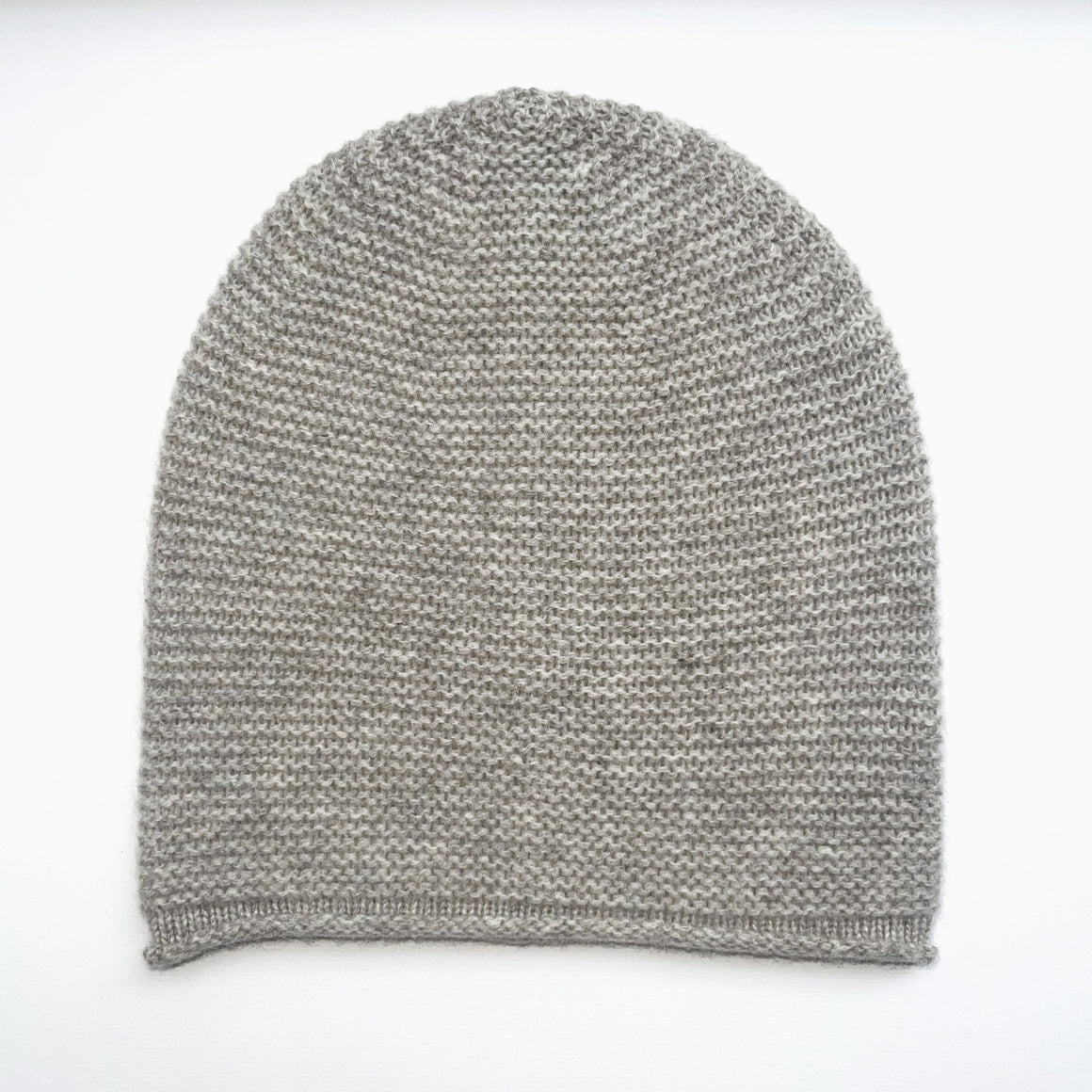Gray knit beanie on a white background