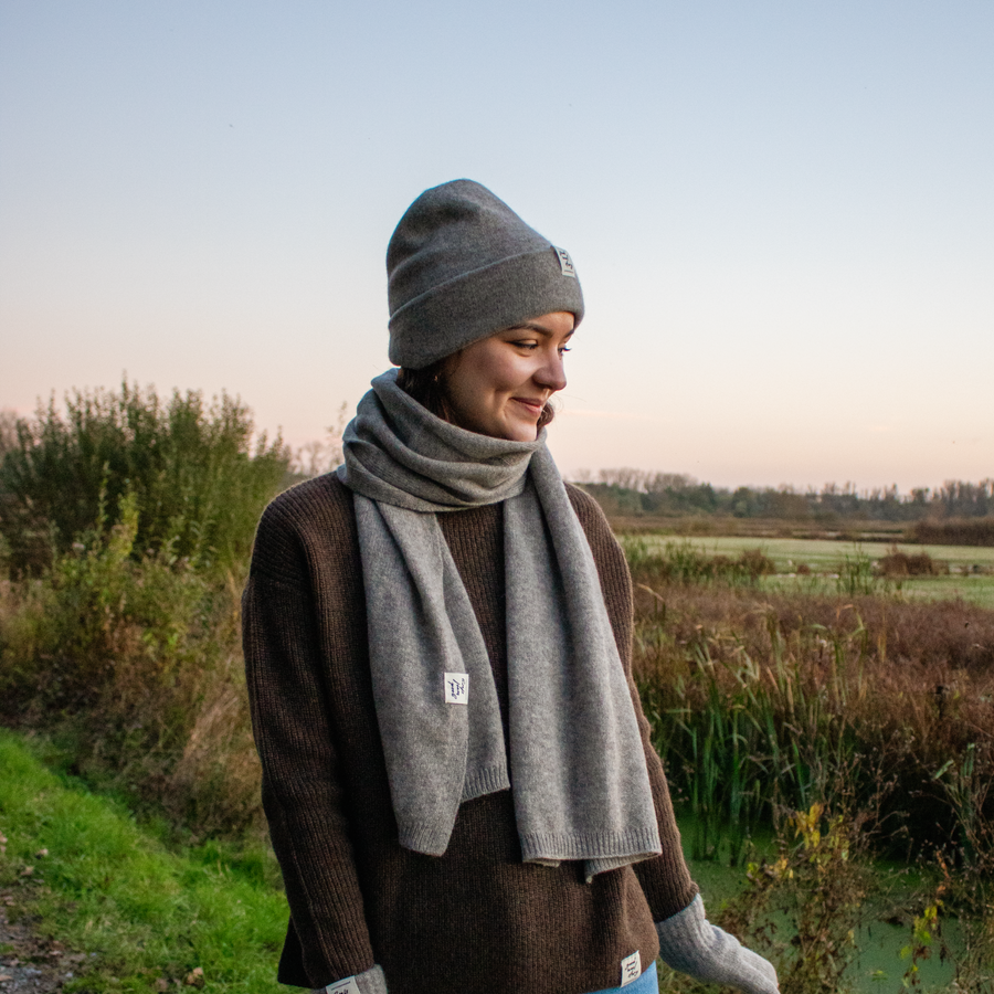 Gray beanie with a label on a black background