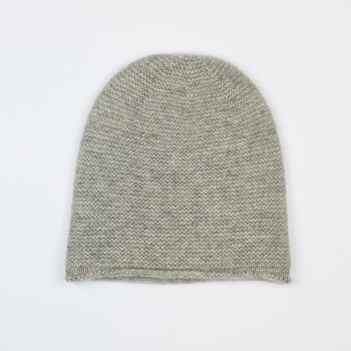 Brown knit beanie on a white background